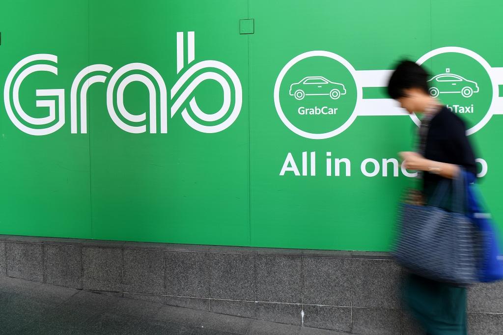 Singapura Denda Grab dan Uber 9,5 Juta Dollar AS