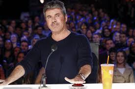 Juri X Factor Simon Cowell  Jatuh Dari Sepeda Listrik